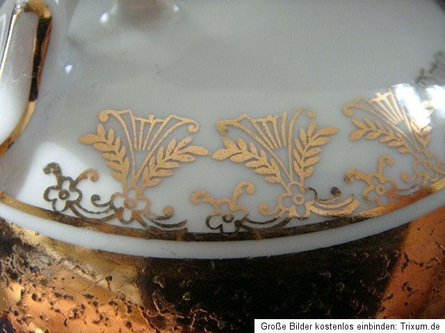 eine alte sehr dekorative Deckeldose mit reichlich Golddekor verziert